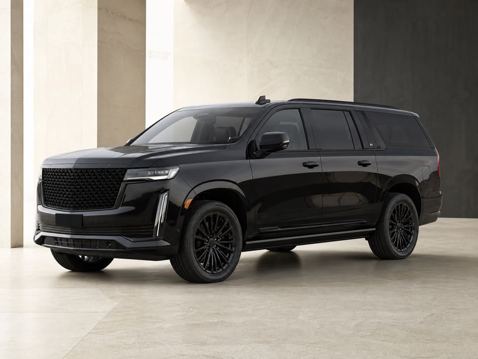 Black executive SUV prepared for a city-to-city journey